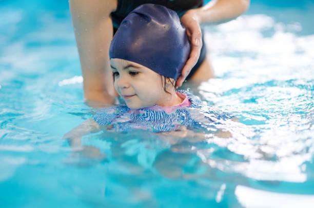 istock Practice to dive in swimming school 1308222972