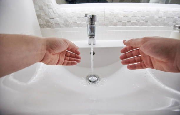washing hands in sink - water human hand stream clean imagens e fotografias de stock
