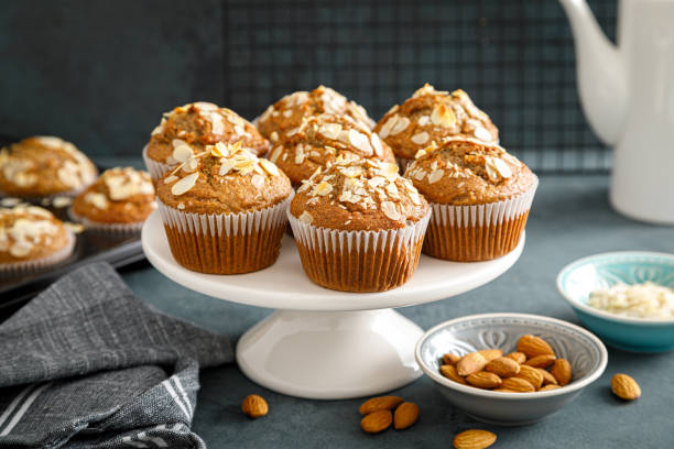 Healthy gluten free almond muffins with nut slices Healthy gluten free almond muffins with nut slices muffin stock pictures, royalty-free photos & images