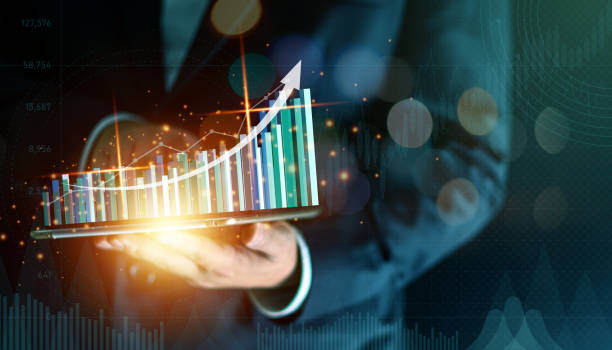 istock Businessman holding tablet with virtual growing financial graph. Business strategy concept. DIgital marketing. 1308225683