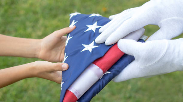 istock Ceremony of a giving a  folded flag 1308225802
