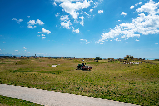Antalya, Turkey-March 19, 2021: the workers are maintaining and preparing the golf course for 2021 season in Antalya, Turkey