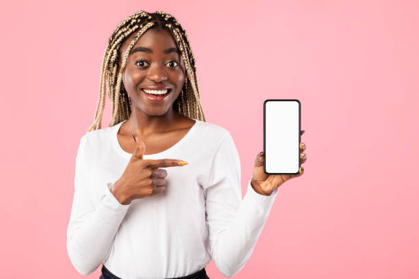 istock Black lady showing blank empty smartphone screen for mockup 1308227302