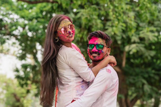 istock Young Indian couples celebrating Holi festival 1308227521