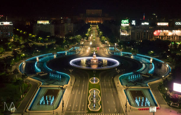 Bucharest Union Square Night aerial shoot of the Unirii Square in Buchrest looking to Unirii Boulevard bucharest stock pictures, royalty-free photos & images