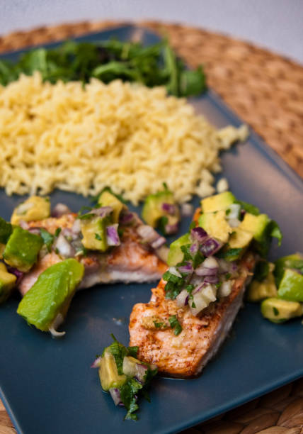 istock Fried salmon with avocado and rice 1308232509