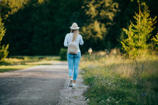 istock Happy woman hiking in mountains 1308232678
