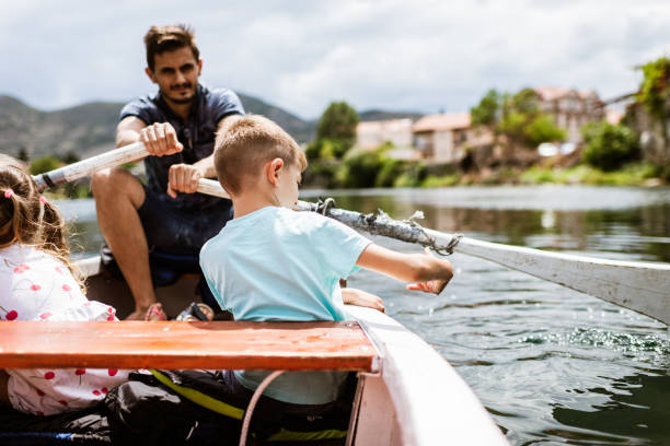 istock Young family enjoying boat ride 1308232774