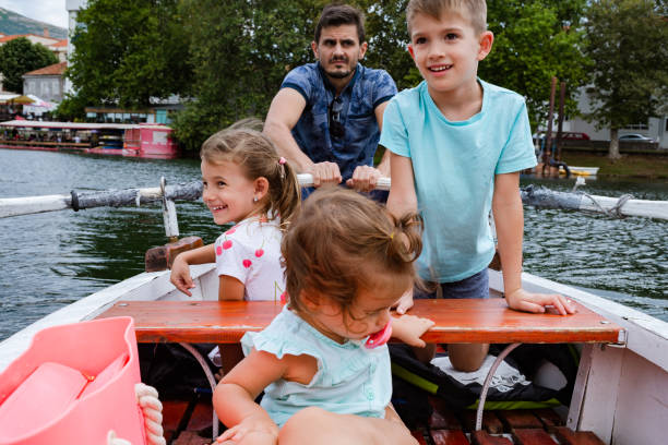istock Young family enjoying boat ride 1308233293