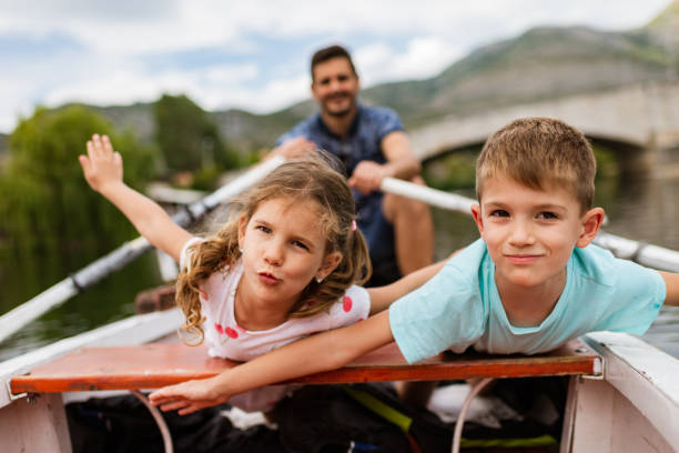 istock Young family enjoying boat ride 1308233417