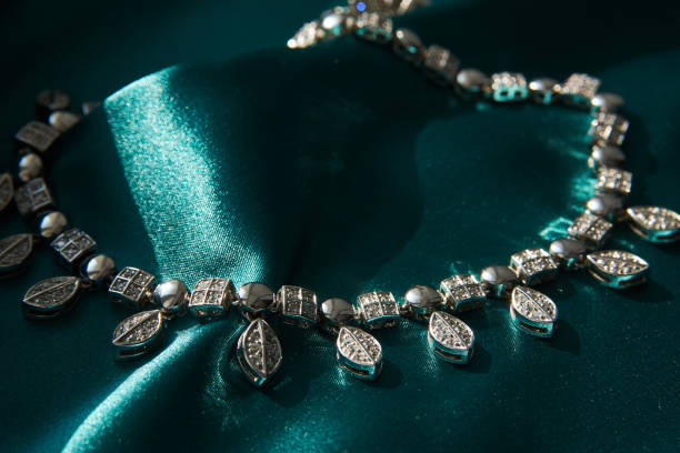 istock Elegant necklace with diamonds on grey background with copy space 1308236202
