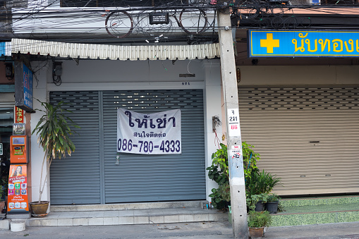 Closed small business shops out of business in Bangkok in crisis of 2021. Scene is in Bangkok Ladprao Chokchai 4
