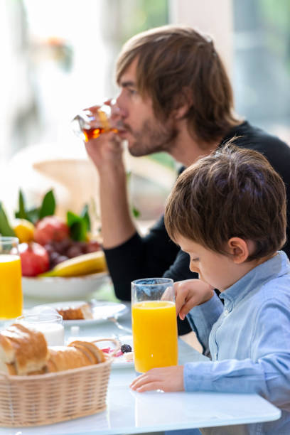 istock Father and son having breakfast on the weekend 1308237358