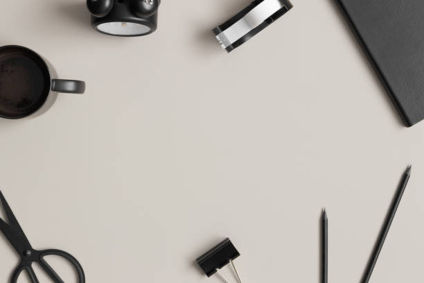 istock Workspace accessories, notebook and a cup of coffee on a beige table.  Flat lay with blank copy space. 1308237441