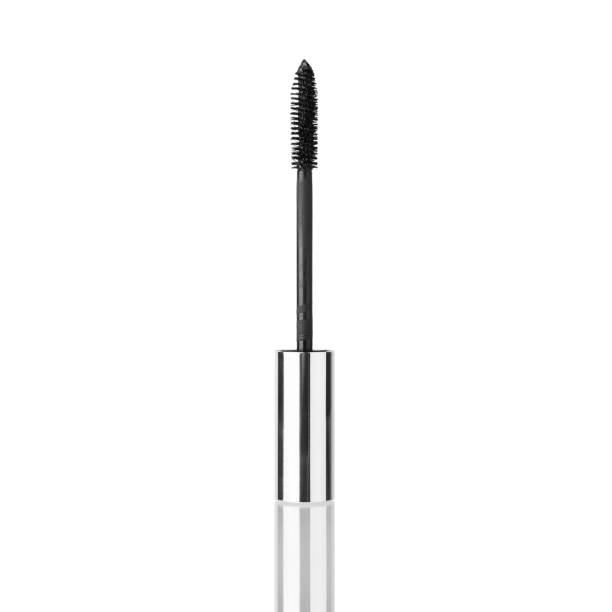 istock Black mascara brush white background mirror reflection isolated closeup, eyelash silver metal applicator stick, eye lashes wand, eye mascara container, tube, package, box, makeup accessory, cosmetics 1308240454