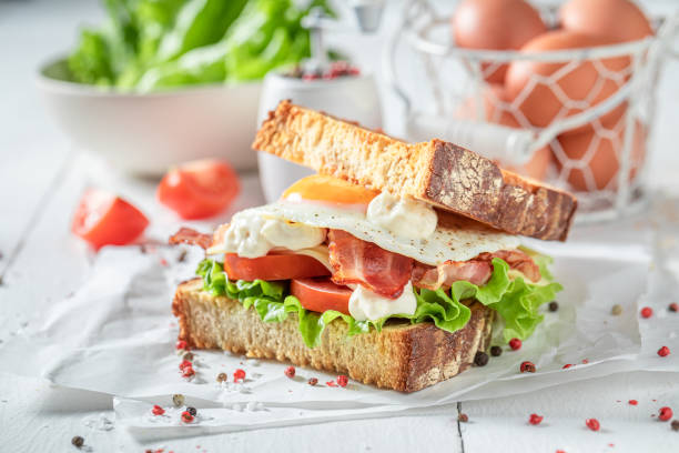 istock Homemade toasted bread with egg, vegetables and bacon. British breakfast. 1308241501