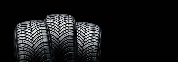 istock three summer modern tires on a black background. place for advertising and text copyspace 1308241546