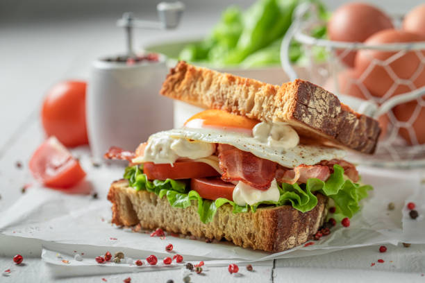 istock Tasty toasted bread with egg, vegetables and bacon. British breakfast. 1308241556
