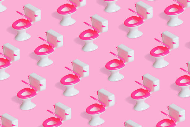 istock Simple pattern with a toilet bowl on bright pink background. 1308241819