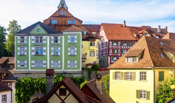 Meersburg city in Baden-Wurttemberg, Germany, Europe. Panorama of colorful houses in summer, scenery of old town of Meersburg. Densely standing residential buildings or hotels in tourist district.