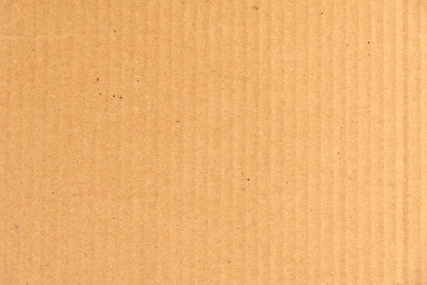 istock Cardboard paper yellowish background - template from packaging cardboard made from recycled materials 1308242049