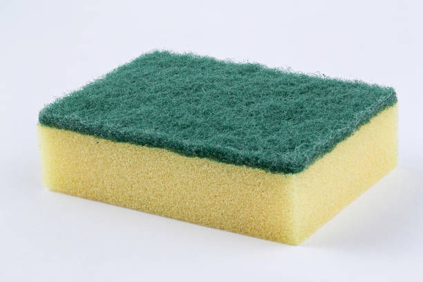 istock Yellow kitchen sponge against on white background. 1308242059