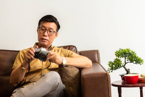 Asian Man Take Care His Antique Camera