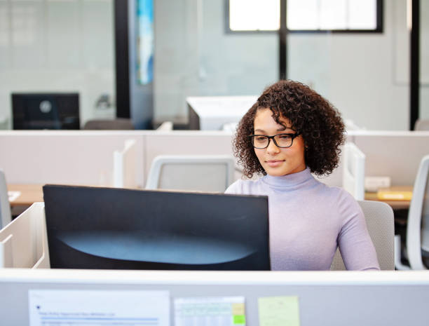 istock Woman Working at her Desk 1308251776
