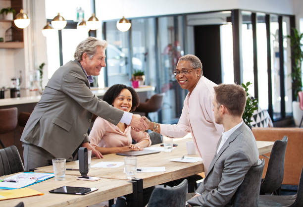 istock Congratulating a Coworker of a Successful Presentation 1308251777