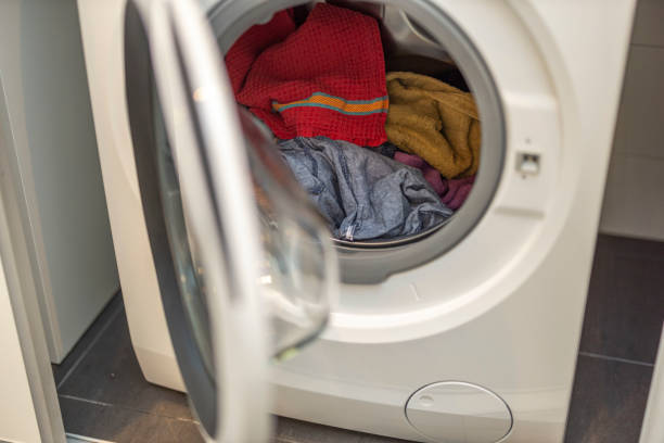 istock Close up view of washed laundry in a laundry  machine. Home routine concept. Sweden. 1308253116