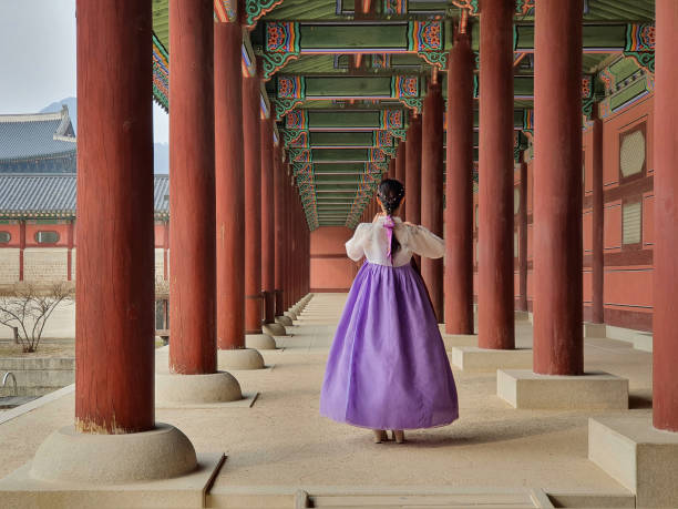 Woman wearing Hanbok (traditional Korean clothes) in Gyeongbokgung Palace in Seoul, Korea stock photo