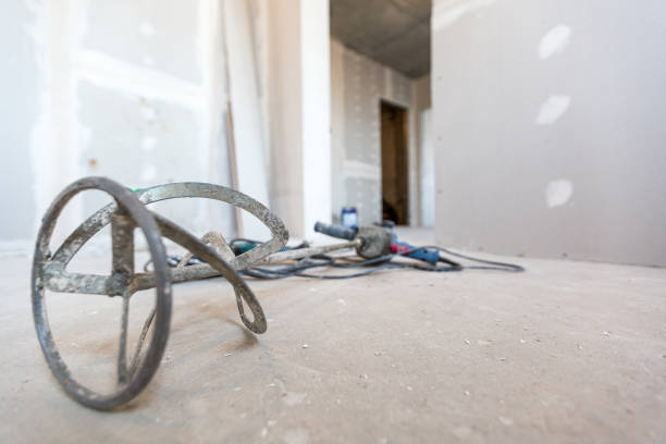 istock Construction tool -manual concrete mixer is on the floor in apartment is under construction, remodeling, renovation, extension, restoration and reconstruction. 1308257355