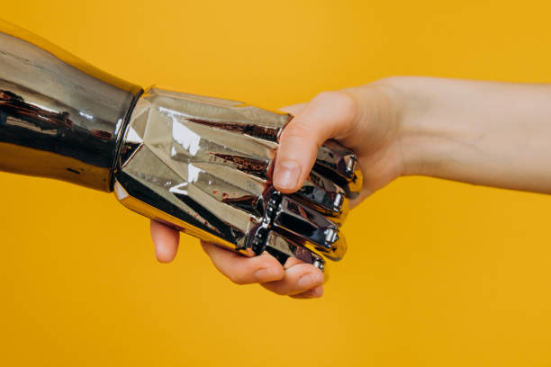 istock Injured person with bionic prosthesis joins hands with woman 1308257404