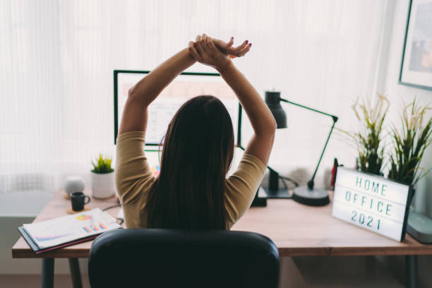 istock COVID-19 Home office midday relaxation exercise 1308262506