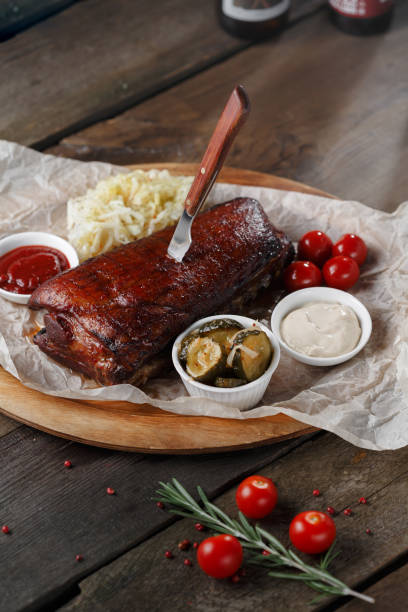 istock Beat steak on wooden table with tomatoes 1308263811