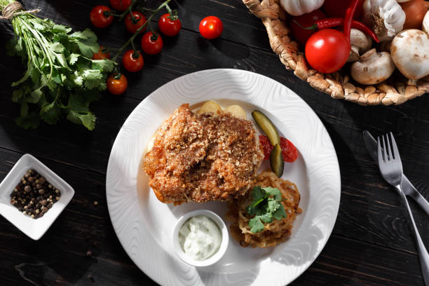 istock Chicken schnitzel and fresh vegetables 1308263866