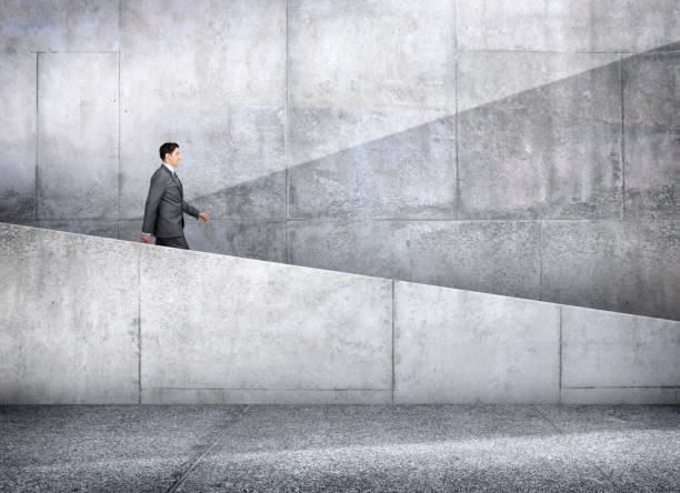 istock Businessman Walking Down Concrete Ramp 1308264970