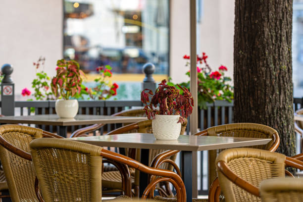 istock empty tables and chairs at a street cafe 1308267025