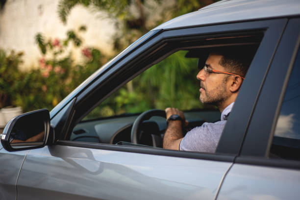 istock Portrait of smiling driver inside the car 1308267604