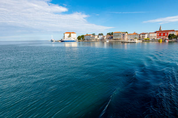 Panoramic view of an old city Porec , Istria peninsula, with crystal clear sea water and heavenly blue sky