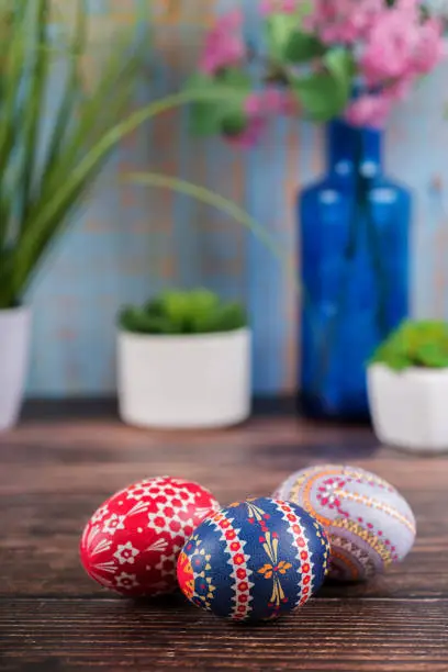Sorbian Easter eggs with plants decoration on a table