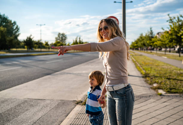 istock Mother and son crossing the road 1308270197