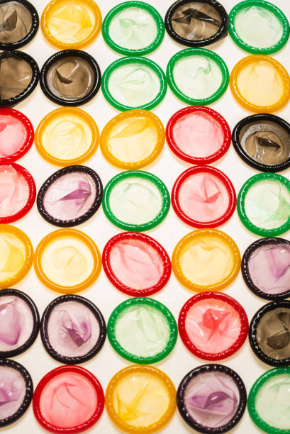 istock Colorful condoms background. 1308270613