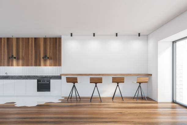 istock Modern kitchen interior with copy space on white wall, wooden countertops with a built in cooker. mock up. 1308270820