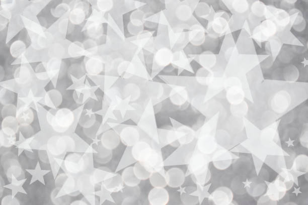 istock Gray bokeh lights with stars 1308271550