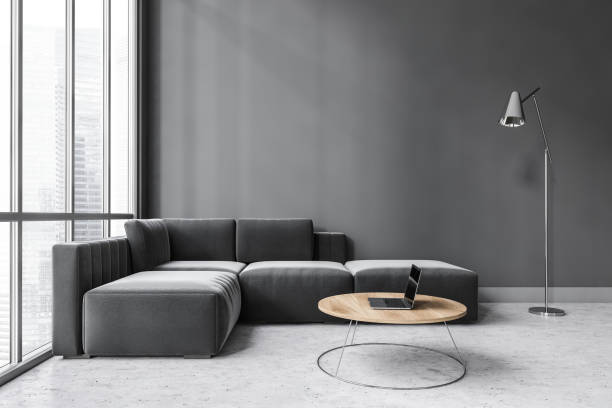 istock Dark living room with black sofa on grey marble floor with coffee table 1308271575
