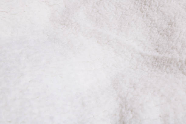 istock Texture of white woolen clothes close up 1308271986