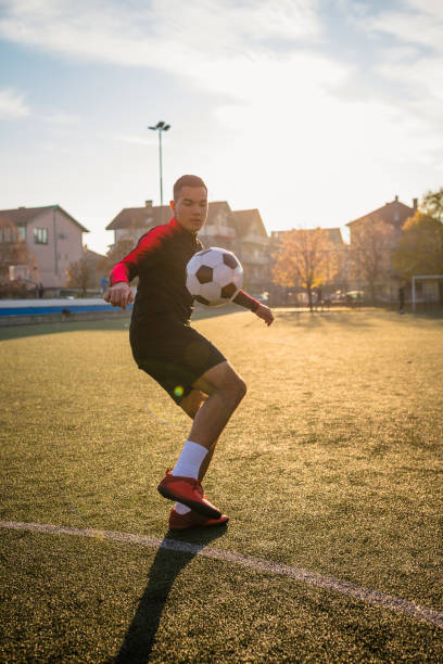 Soccer player playing with the ball