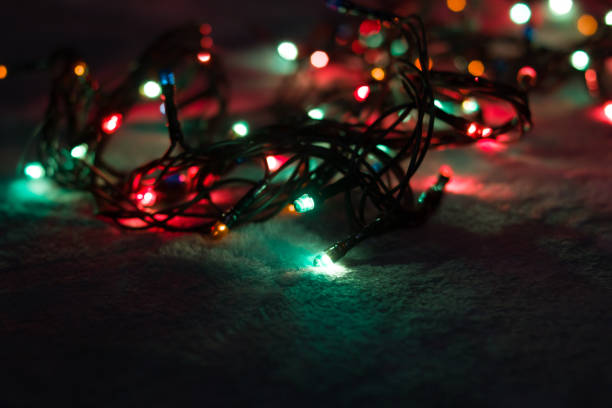 istock Multicolored light bulbs garlands in the dark 1308272315