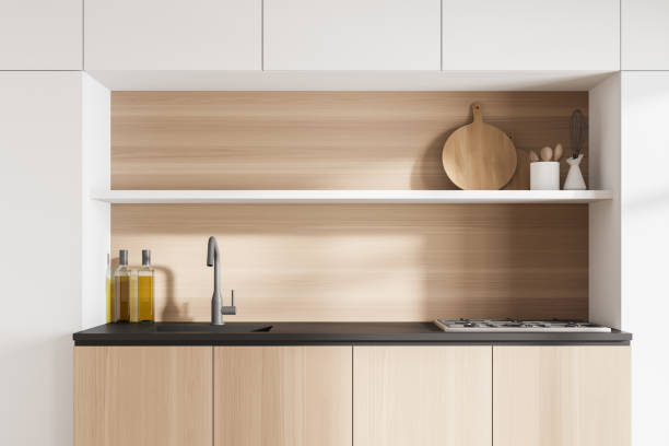 istock Light wooden kitchen set with shelves and deck with appliances 1308273059